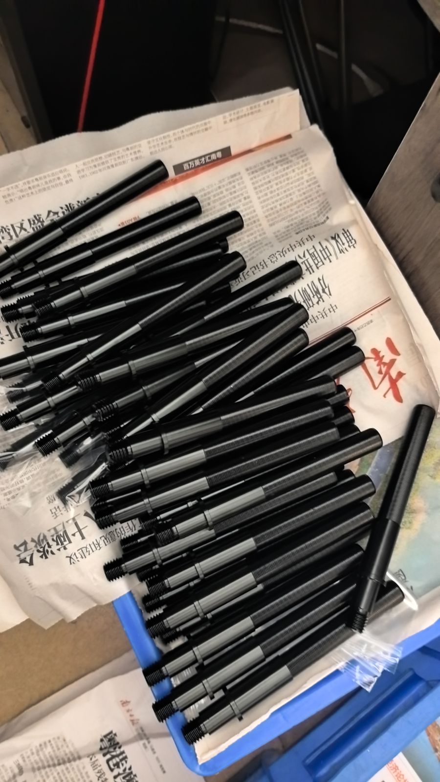 Shafts with black oxide finish in a batch